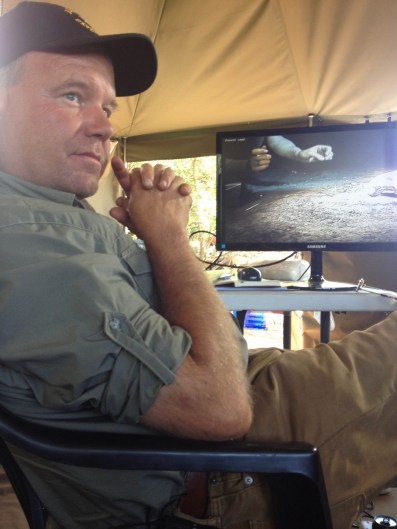 Advance underground scientists excavate the Dinaledi Chamber under the watchful eye of Lee Berger in the Command Tent. (Image by K Lindsay Hunter)